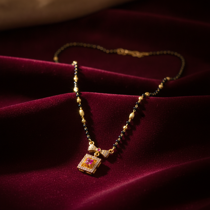 Elegant Black Bead Mangalsutra with Sparkling CZ Bow and Ruby Pendant