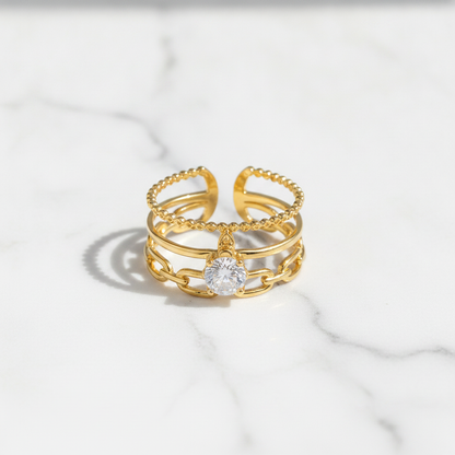 Luxury Triple Band Gold Ring with Brilliant Solitaire Stone